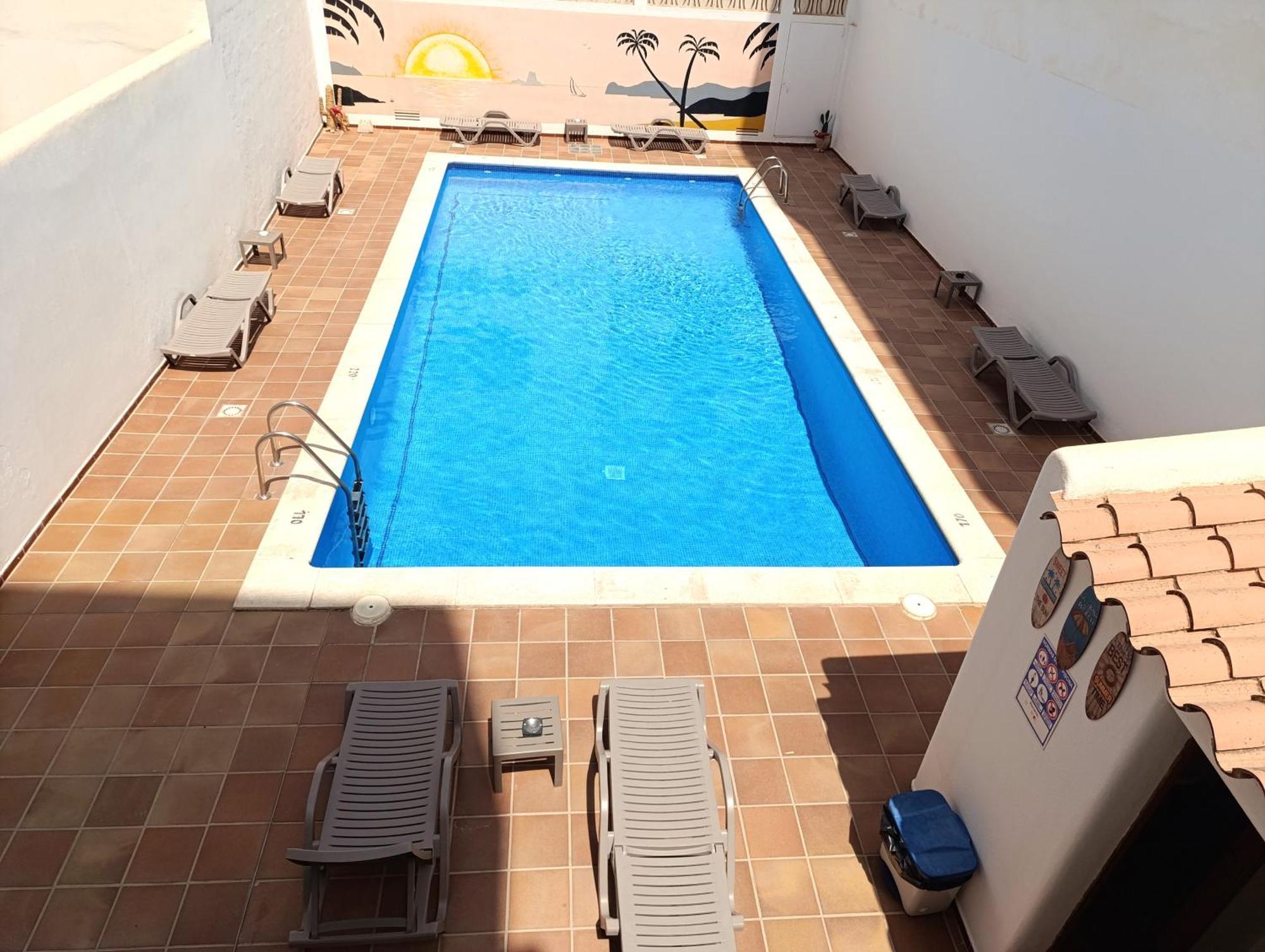 Hostal Horizonte Сан-Антонио-Абад Экстерьер фото A swimming pool